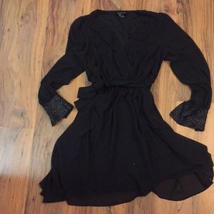 Black dress with sequin cuffs